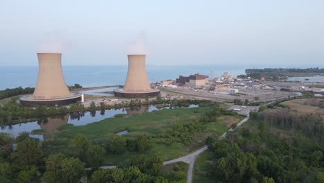 steam rises from enrico fermi ii nuclear power plant for reactors cooling, aerial view