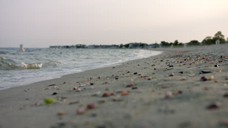 Waves-Splashing-At-Jennings-Beach-In-Connecticut-With-Sea-Shells-On-Sandy-Shore