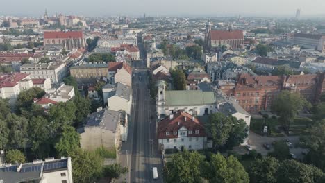 aerial drone shot of kazimierz neighborhood of krakow poland with the river vistula at sunrise