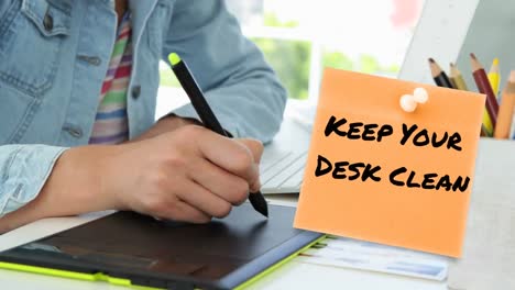 animation of keep your desk clean text over hands of caucasian businesswoman wrting