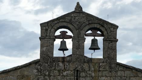 santiago de gustei bell tower silhouette, showing iconic twin bells in galicia, spain