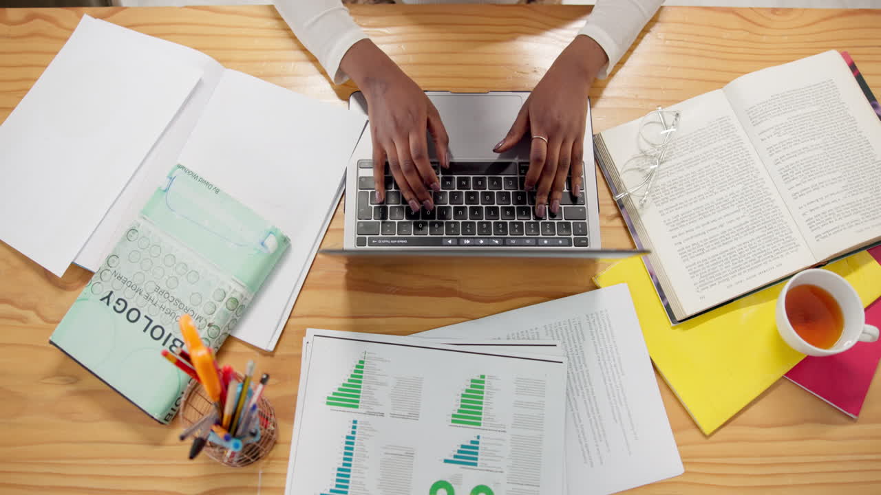 Woman working on laptop at her desk