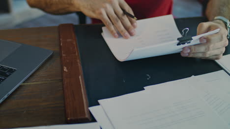 close up of male hand sign document