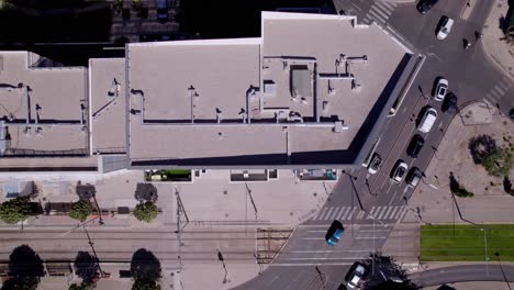 birds eye perspective of an apartment and cars driving on the road next to it in montpellier france