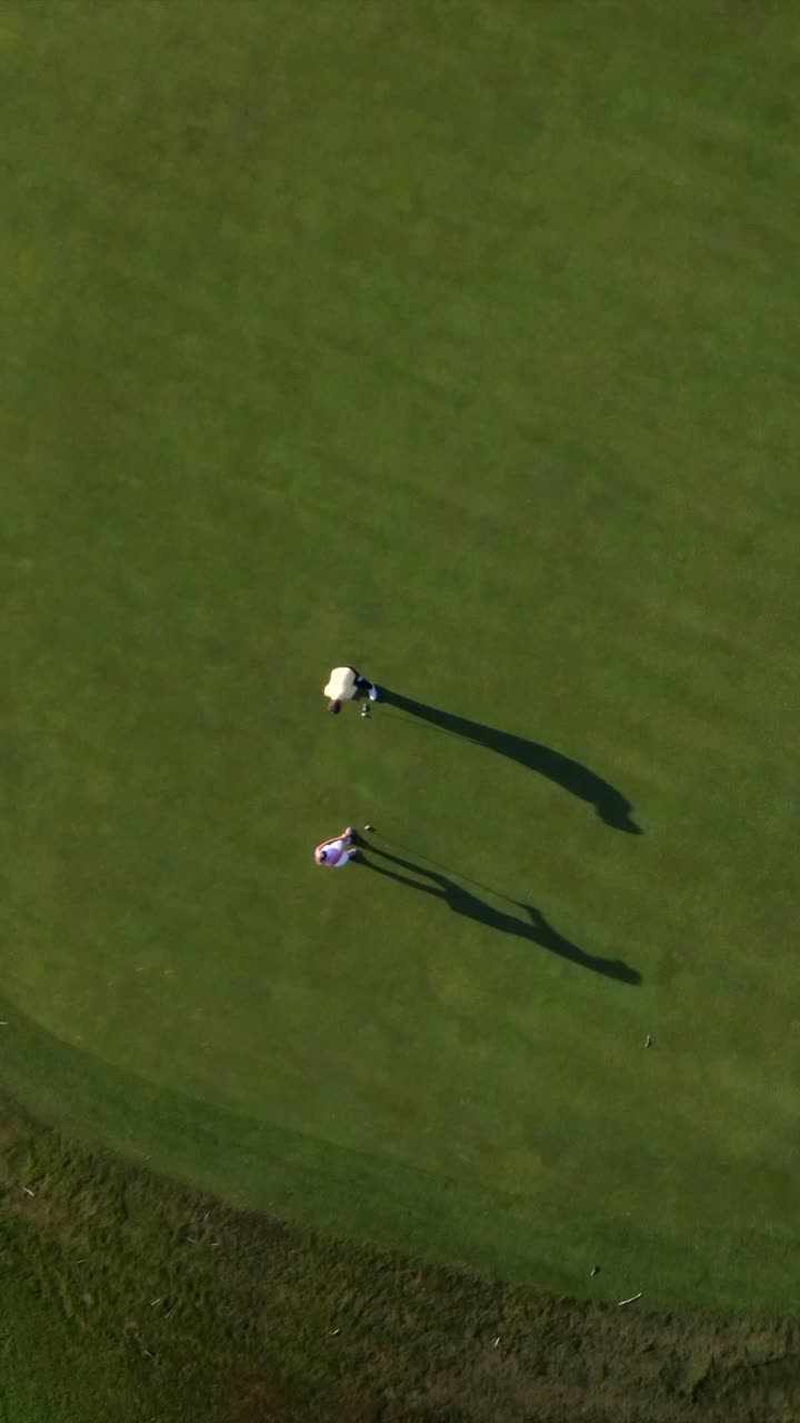 Golfers on a Green Golf Course