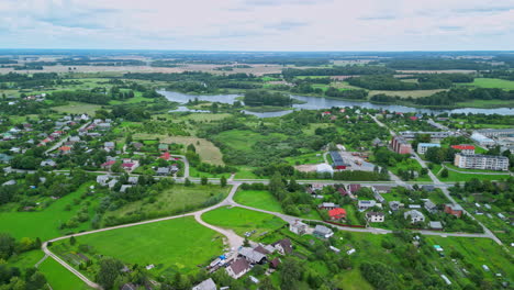 drone video. rural houses, forest and green fields