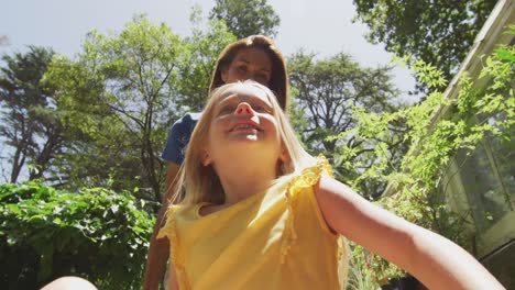 mother and daughter enjoying time in garden