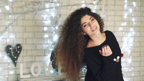 woman portrait in christmas room. young pretty woman with fashion hair and makeup posing at christmas interior
