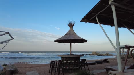 a charming cafe near the azov sea invites guests to unwind while enjoying the view of the tranquil shoreline and soft waves lapping at the sand