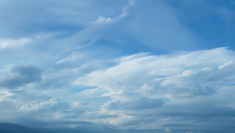 blue sky with white fluffy clouds