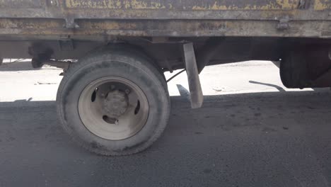 wheels freight truck rotating during drive on suburban road