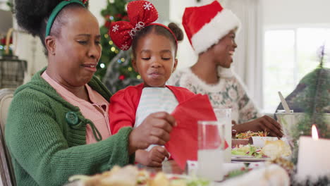 Happy-african-american-family-having-christmas-dinner