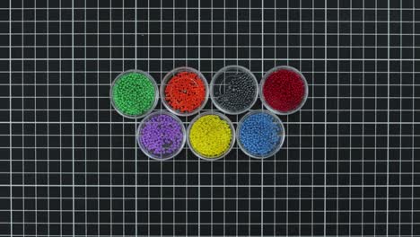 organization of beads by colours in plastic boxes