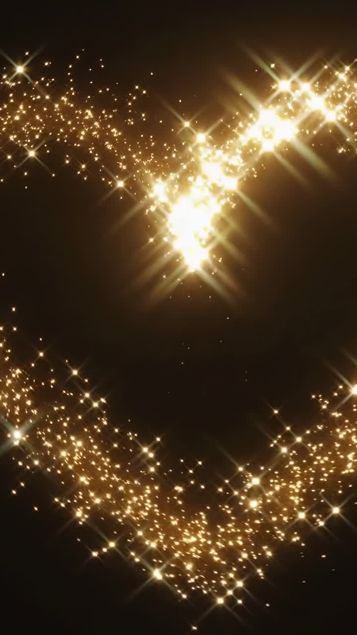 Vídeo vertical: trilha dourada em streaming se movendo através de um vazio negro, fonte fora do quadro criando starbursts