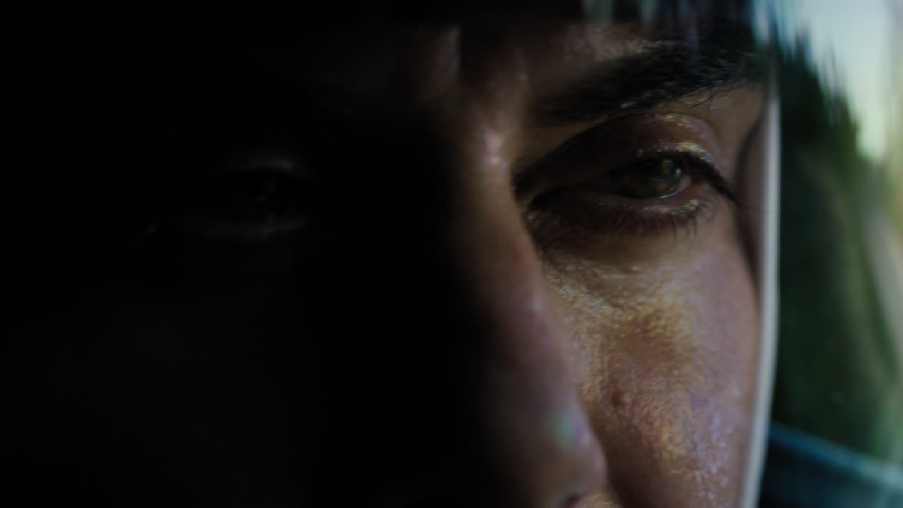 Eyes Of a Man With a Helmet Driving a Car at High Speed in a Tunnel Focused