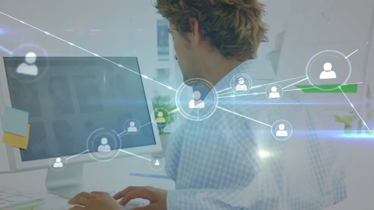 Man typing at keys causing tech network graphic growing onscreen, stretching neck and easing strain