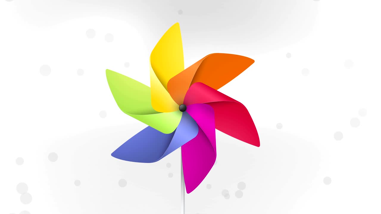 la rueda de colores gira en el viento