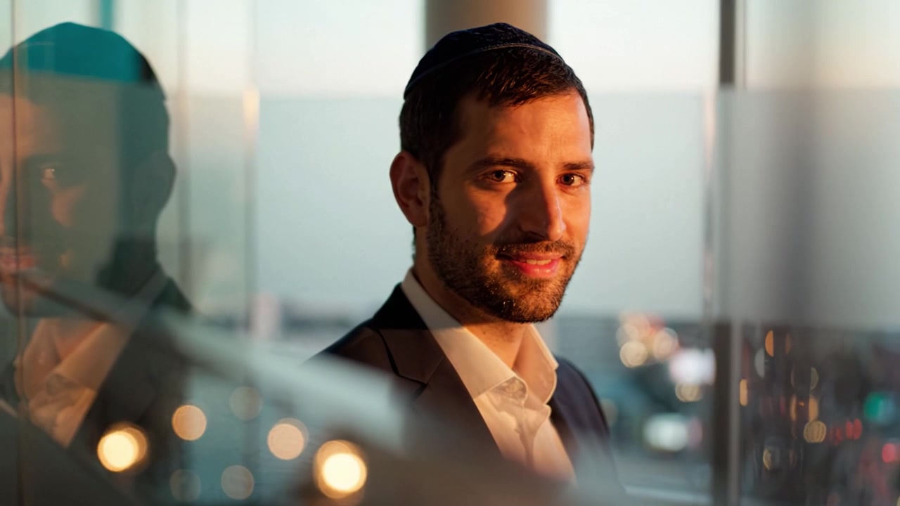 Portrait of a Man in Formal Attire with City Background during Sunset, Showcasing Personality and Charm in a Professional Environment with Reflections