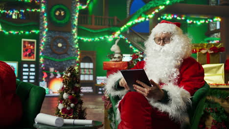 santa claus working on a tablet