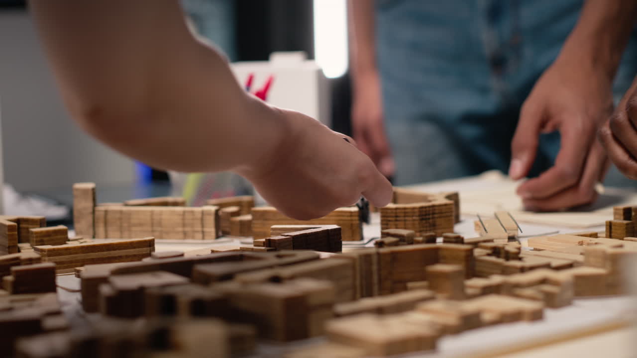 Vertical Video Close up of contractors arranging layout for a housing master plan