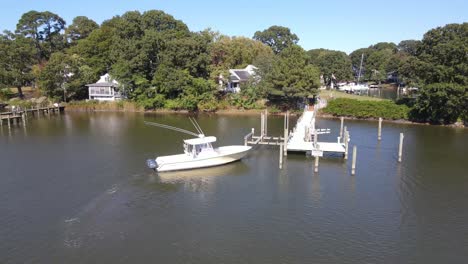 a boat docking off of the chesapeake bay on a nice bright sunny day