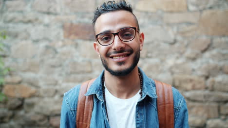 smiling man with backpack