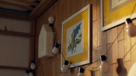 dragon picture on wooden wall with string lights