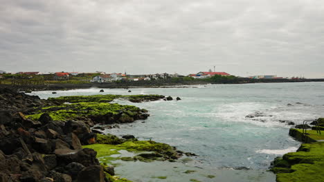 Small-local-town-located-on-the-rocky-coastline-of-the-Azores-Islands,-Atlantic-ocean,-Portugal