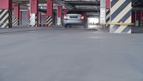 automobile driving through parking lot