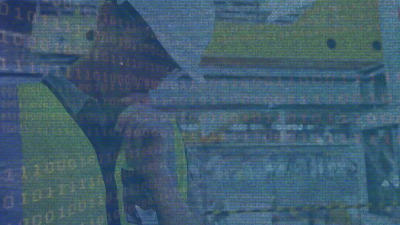 Animation of glitch and binary code over caucasian male builder in helmet using tablet