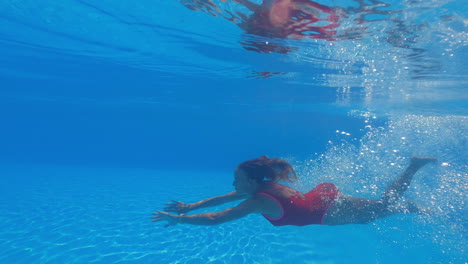 girl underwater swimming