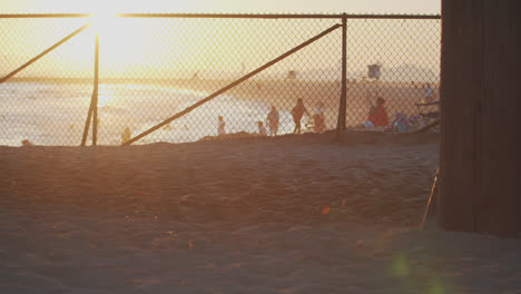 seal beach pier at sunset with people