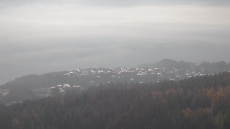 Wide-rotating-Aerial-of-mountain-town-in-European-Alps,-Switzerland