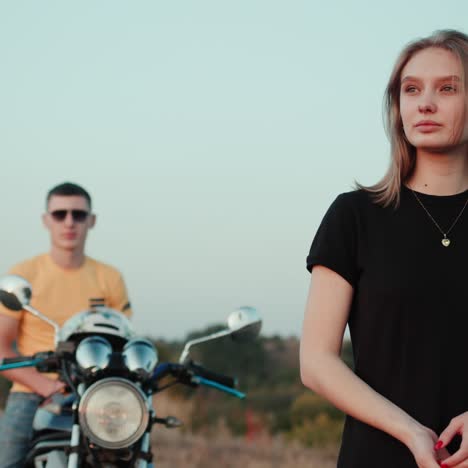 man and woman on motorcycle