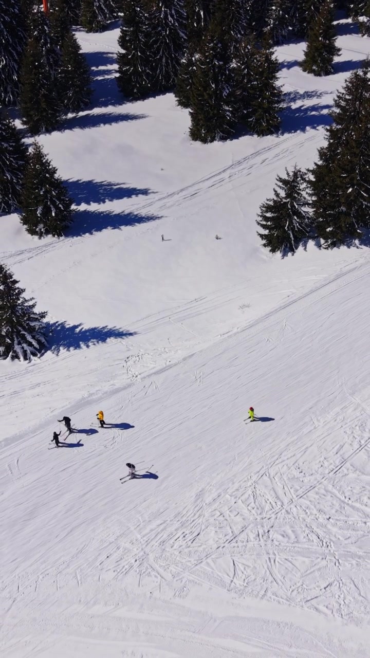 Skiers enjoying the slopes in the Carpathians, Bulgaria during winter
