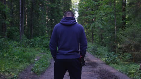 man hiking in forest