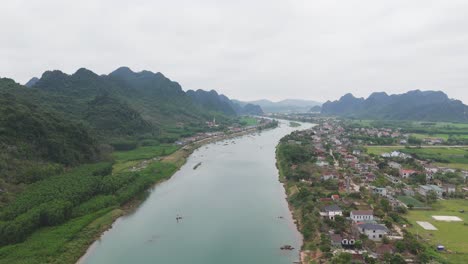 aerial footage of river and green forest with mountain natural landscape in vietnam, india