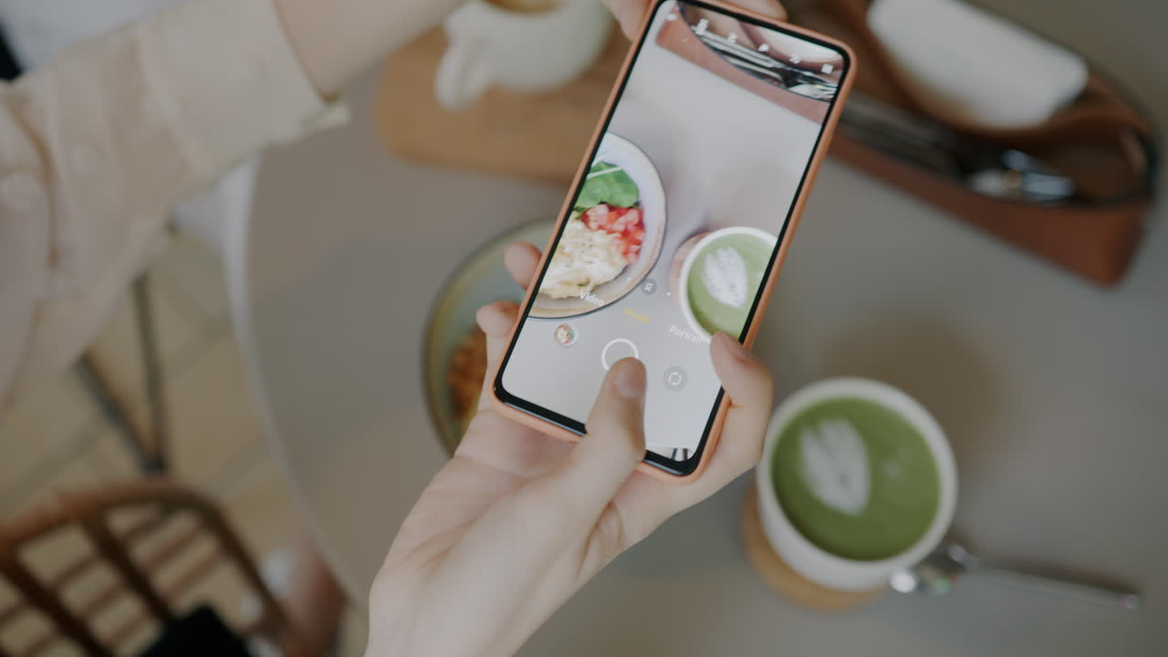 Taking a photo of food at a cafe