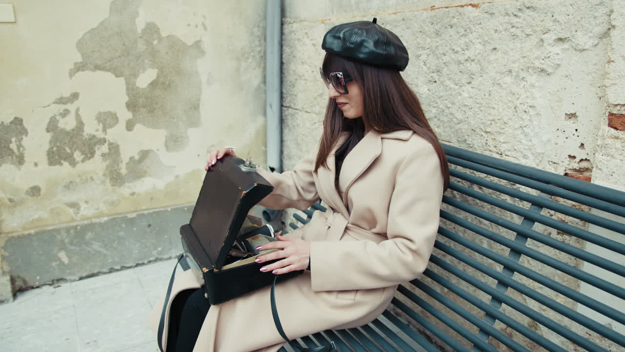 Woman Sitting On The Bench Opening The Bag With The Vintage Camera