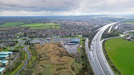 aerial drone cinematic video footage of the m1 motorway near the city of wakefield, west yorkshire, uk