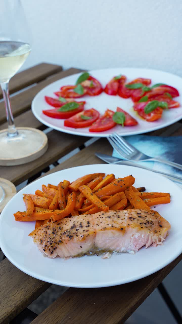 Salmon, Wine and Tomato Salad Dinner Outdoors on Cozy Urban Balcony