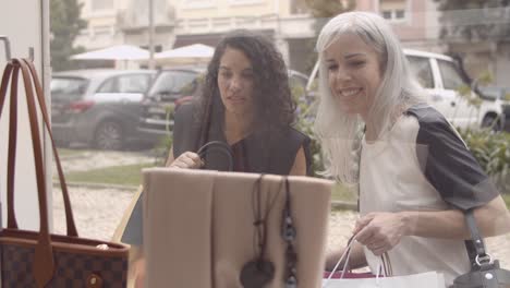 excited female shoppers staring at accessories