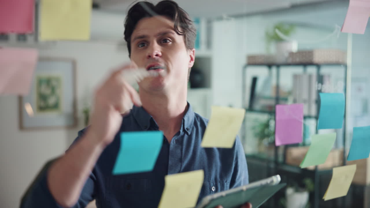 Man using sticky notes for planning