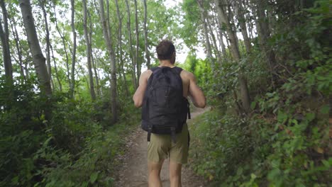 young man walking in nature.