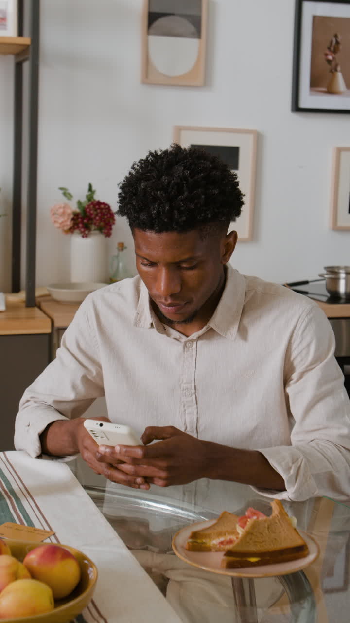 Man using phone while having a meal