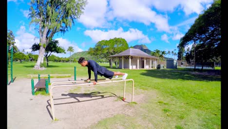 man doing push-ups on parallel bars 4k