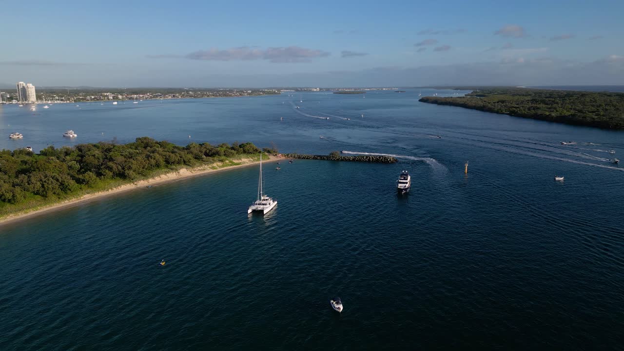 Aerial views of luxury yachts near Wavebreak Island and the Broadwater on the Northern end of the Gold Coast, Australia