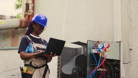 engineer servicing air conditioner