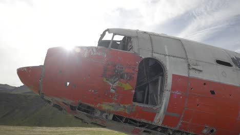 sideway view of crashed aeroplane in the mountain landscape of iceland