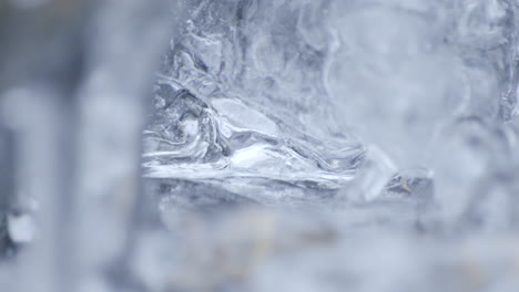 Static-macro-shot-of-water-pulsing-through-a-vein-inside-a-frozen-creek